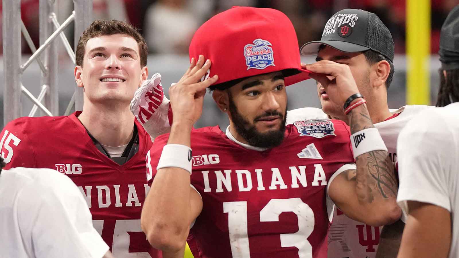 https://wp.clutchpoints.com/wp-content/uploads/2026/01/Indiana-Hoosiers-wide-receiver-Elijah-Sarratt-13-reacts-on-stage-after-the-2025-Peach-Bowl.jpg