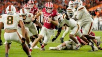 Indiana quarterback Fernando Mendoza (15) rushes into the end zone for a touchdown against Miami during the College Football Playoff national championship game at Hard Rock Stadium in Miami Gardens, Fla., on Jan. 19, 2026.