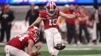 ndiana Hoosiers kicker Nicolas Radicic (15) kicks an extra point from the hold of punter Mitch McCarthy (44) against the Oregon Ducks during the first half of the 2025 Peach Bowl and semifinal game of the College Football Playoff at Mercedes-Benz Stadium.