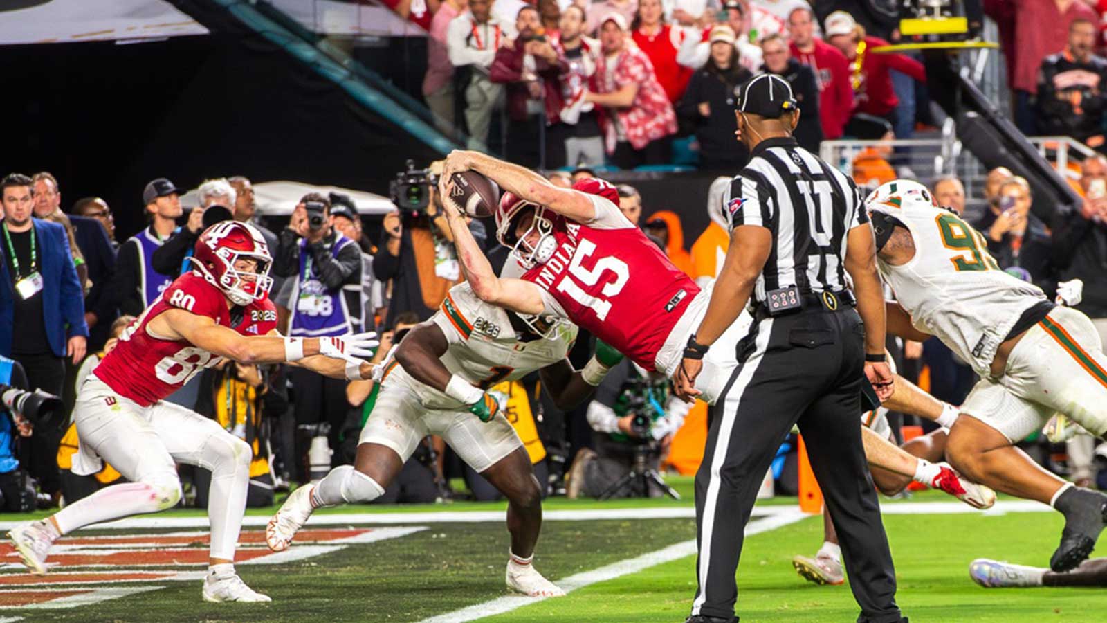 Indiana's Fernando Mendoza (15) scores a touchdown during the College Football Playoff National Championship college football game at Hard Rock Stadium in Miami Gardens on Monday, Jan. 19, 2026.