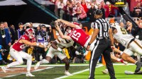 Indiana's Fernando Mendoza (15) scores a touchdown during the College Football Playoff National Championship college football game at Hard Rock Stadium in Miami Gardens on Monday, Jan. 19, 2026.