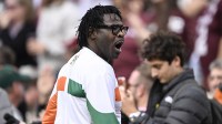 Former Miami Hurricanes player Michael Irvin celebrates after an interception against the Texas A&M Aggies during the second half of the first round game of the CFP National Playoff at Kyle Field.
