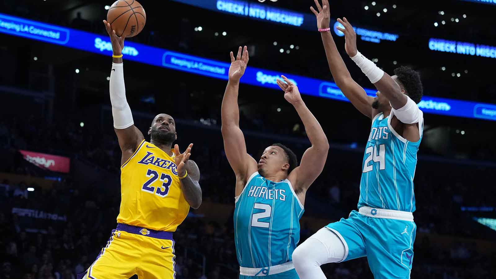 Los Angeles Lakers forward LeBron James (23) shoots the ball against Charlotte Hornets forward Grant Williams (2) and forward Brandon Miller (24) in the first half at Crypto.com Arena.