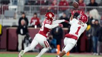 Alabama's Isaiah Horton (1) makes a reception as OklahomaÕs Eli Bowen (23) defends in the second half of the College Football Playoff game between the University of Oklahoma Sooners (OU) and the Alabama Crimson Tide at the Gaylord Family - Oklahoma Memorial Stadium in Norman, Okla., Friday Dec. 19, 2025.
