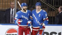 New York Rangers center Vincent Trocheck (16) celebrates with center J.T. Miller (8) after scoring a goal in the third period against the Buffalo Sabres at Madison Square Garden