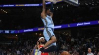 Memphis Grizzlies guard Ja Morant (12) dunks during the fourth quarter against the Atlanta Hawks at FedExForum.