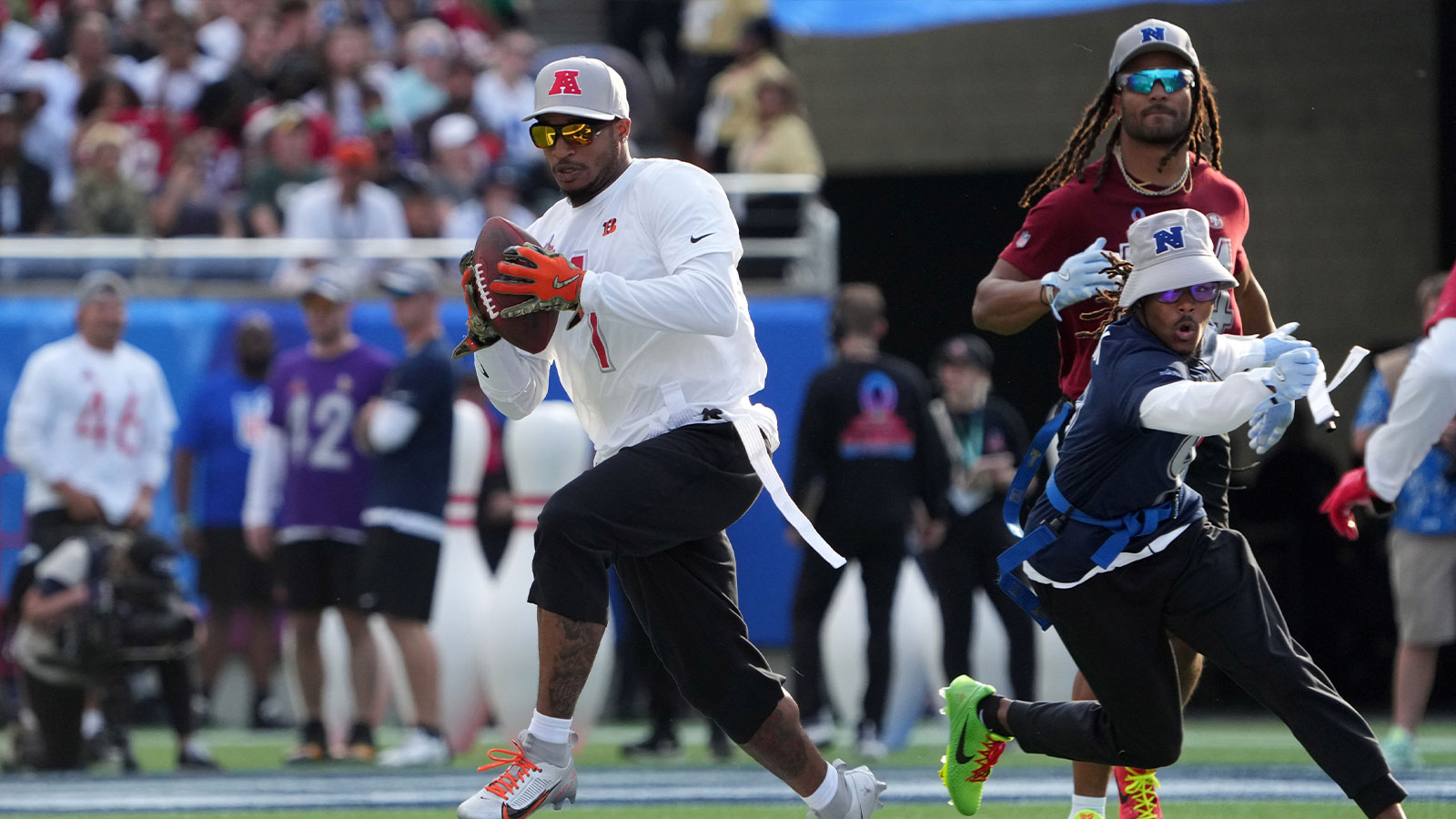 AFC wide receiver Ja'Marr Chase of the Cincinnatti Bengals (1) catches the ball against NFC return specialist KaVontae Turpin of the Dallas Cowboys (9)during the 2025 Pro Bowl Games at Camping World Stadium. 