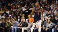 Arizona Wildcats guard Jaden Bradley (0) dribbles up the court in the second half against the Central Florida Knights at Addition Financial Arena.