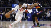 Detroit Pistons guard Jaden Ivey (23) dribbles defended by Phoenix Suns guard Jordan Goodwin (23) in the second half at Little Caesars Arena.