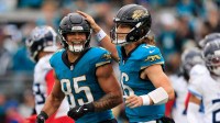 Jacksonville Jaguars tight end Brenton Strange (85) is congratulated by quarterback Trevor Lawrence (16) during the second quarter.