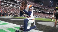 Denver Broncos cornerback Jahdae Barron (23) kneels in the end zone prior to a game against the Las Vegas Raiders during the first half at Allegiant Stadium.