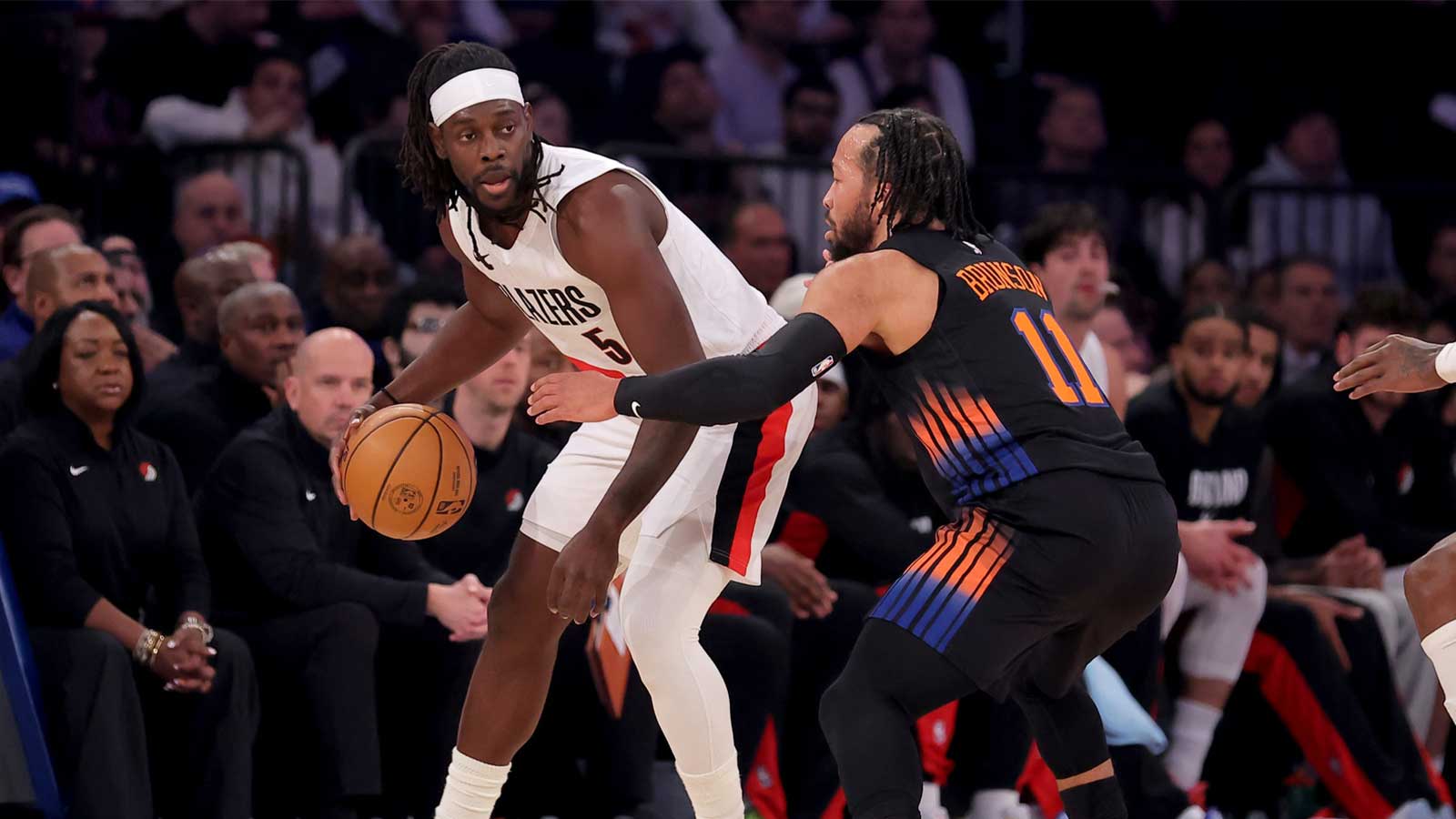 Portland Trail Blazers guard Jrue Holiday (5) controls the ball against New York Knicks guard Jalen Brunson (11) during the first quarter at Madison Square Garden.