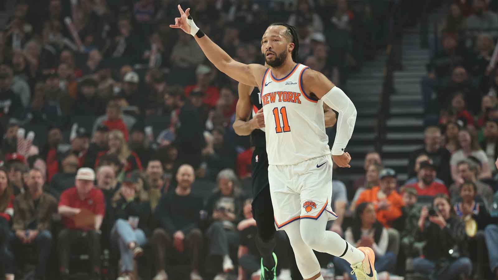 New York Knicks guard Jalen Brunson (11) reacts after scoring a three-point shot against the Portland Trail Blazers during the first half at Moda Center. 