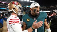 San Francisco 49ers quarterback Brock Purdy (13) speaks with Philadelphia Eagles quarterback Jalen Hurts (1) after an NFC Wild Card Round game at Lincoln Financial Field.