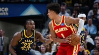 Atlanta Hawks forward Jalen Johnson (1) holds the ball while Indiana Pacers guard/forward Aaron Nesmith (23) defends in the first half at Gainbridge Fieldhouse.