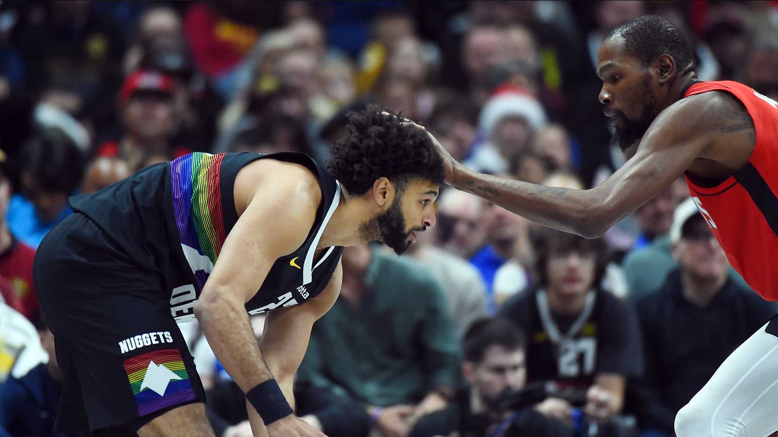 Denver Nuggets guard Jamal Murray (27) is defended by Houston Rockets forward Kevin Durant (7) during the first half at Ball Arena. 