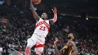 Toronto Raptors guard Jamal Shead (23) shoots a layup above Atlanta Hawks guard Nickeil Alexander-Walker (7) in the second half at Scotiabank Arena.