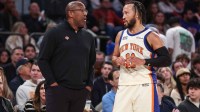 New York Knicks head coach Mike Brown talks with guard Jalen Brunson (11) in the third quarter against the Philadelphia 76ers at Madison Square Garden.