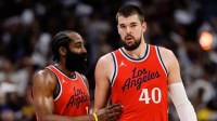 Clippers guard James Harden (1) and center Ivica Zubac (40) in the third quarter against the Denver Nuggets during game two of first round for the 2025 NBA Playoffs at Ball Arena with Clippers' Chris Paul in the background