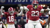 Alabama defensive lineman James Smith (23) celebrates a tackle for a loss on Georgia running back Nate Frazier (3) at Mercedes-Benz Stadium.