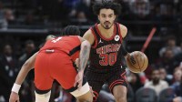 Jan 13, 2026; Houston, Texas, USA; Chicago Bulls guard Tre Jones (30) controls the ball as Houston Rockets guard JD Davison (4) defends during the second quarter at Toyota Center. Mandatory Credit: Troy Taormina-Imagn Images