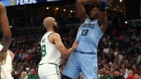 Memphis Grizzlies forward Jaren Jackson Jr. (13) collects a rebound over Boston Celtics guard Derrick White (9) during the second quarter at FedExForum.