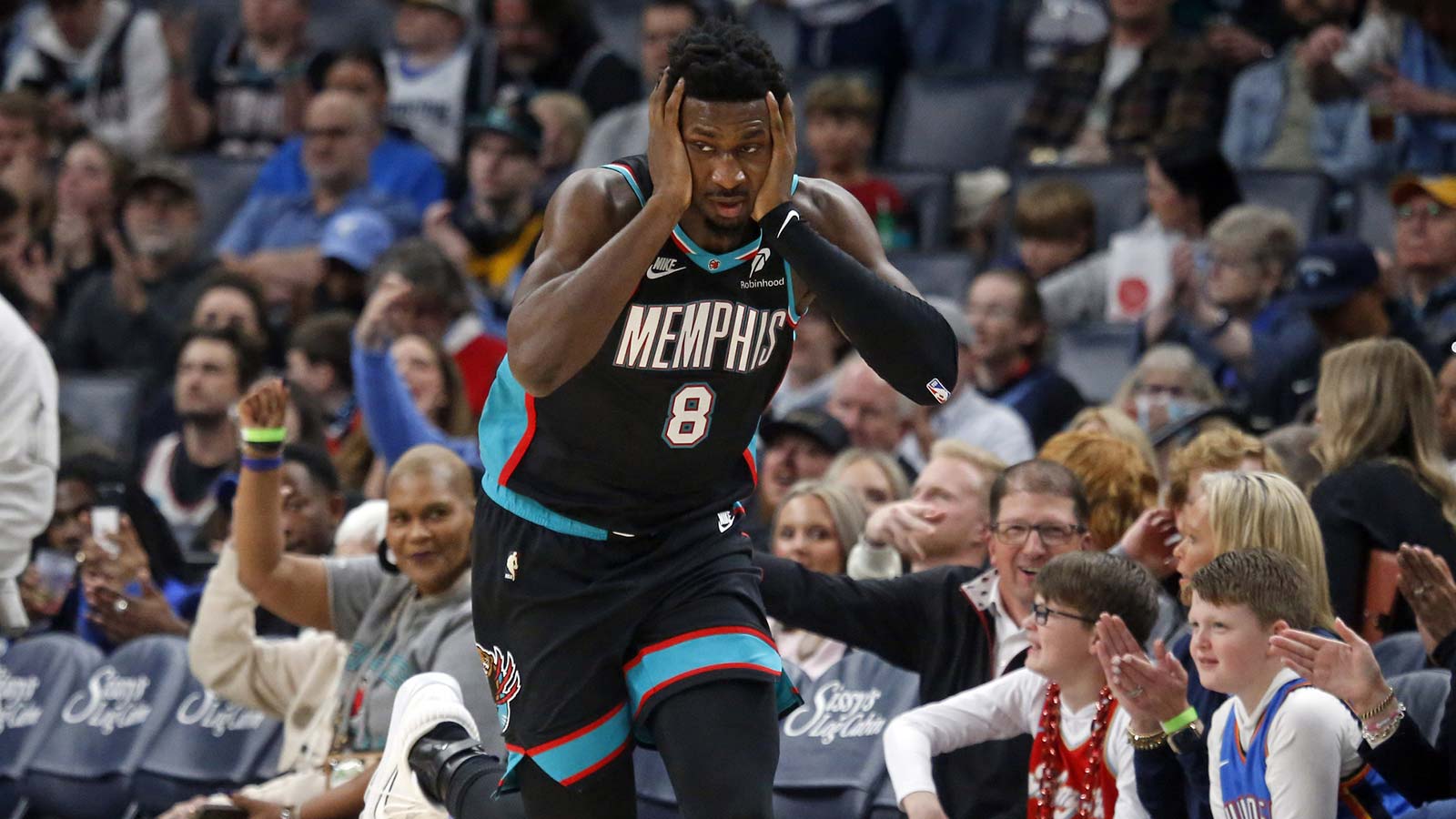 Memphis Grizzlies forward/center Jaren Jackson Jr. (8) reacts after a basket during the first quarter against the Oklahoma City Thunder at FedExForum.