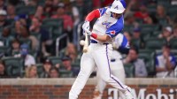 Atlanta Braves right fielder Jarred Kelenic (24) hits a single against the Minnesota Twins in the sixth inning at Truist Park.