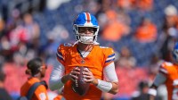 Denver Broncos quarterback Jarrett Stidham (8) warms up before the game against the Las Vegas Raiders at Empower Field at Mile High.