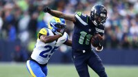 Seattle Seahawks wide receiver Jaxon Smith-Njigba (11) runs against Los Angeles Rams cornerback Roger McCreary (25) during the first half in the 2026 NFC Championship Game at Lumen Field.