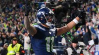 Seattle Seahawks wide receiver Jaxon Smith-Njigba (11) celebrates after scoring a touchdown against the Los Angeles Rams during the first half in the 2026 NFC Championship Game at Lumen Field.
