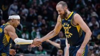 Indiana Pacers guard/forward Andrew Nembhard (2) and center Jay Huff (32) celebrate a made basket in the second half against the Boston Celtics at Gainbridge Fieldhouse.