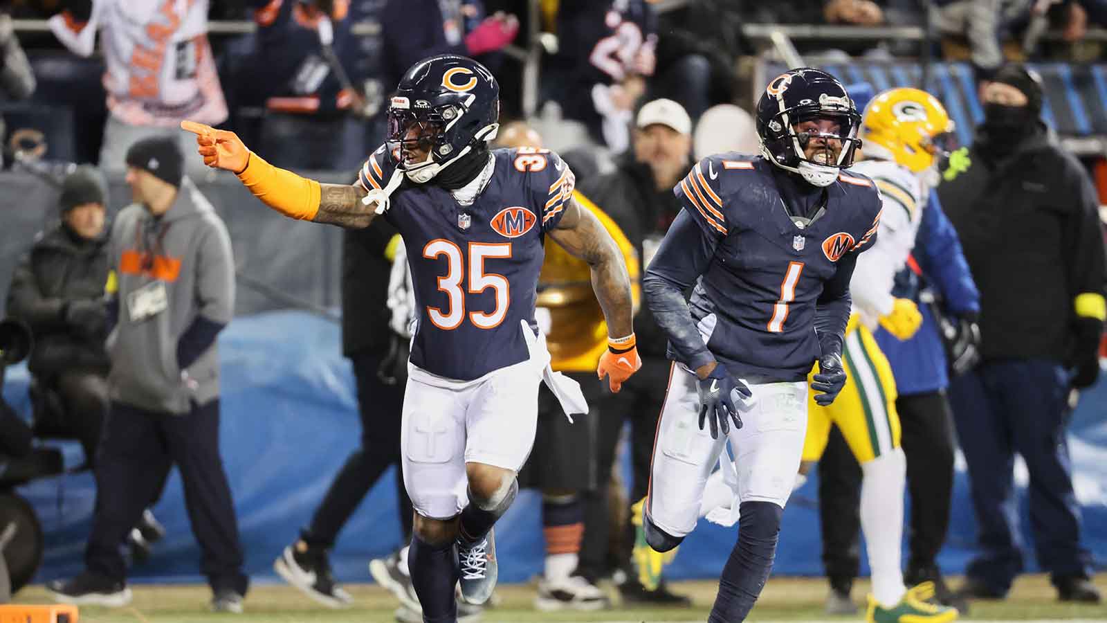 Chicago Bears safety C.J. Gardner-Johnson (35) and cornerback Jaylon Johnson (1) acknowledge the crowd against the Green Bay Packers during the first quarter at Soldier Field.