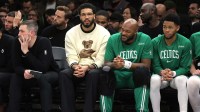 Boston Celtics injured forward Jayson Tatum (0) watches from the bench during the third quarter against the Brooklyn Nets at Barclays Center.