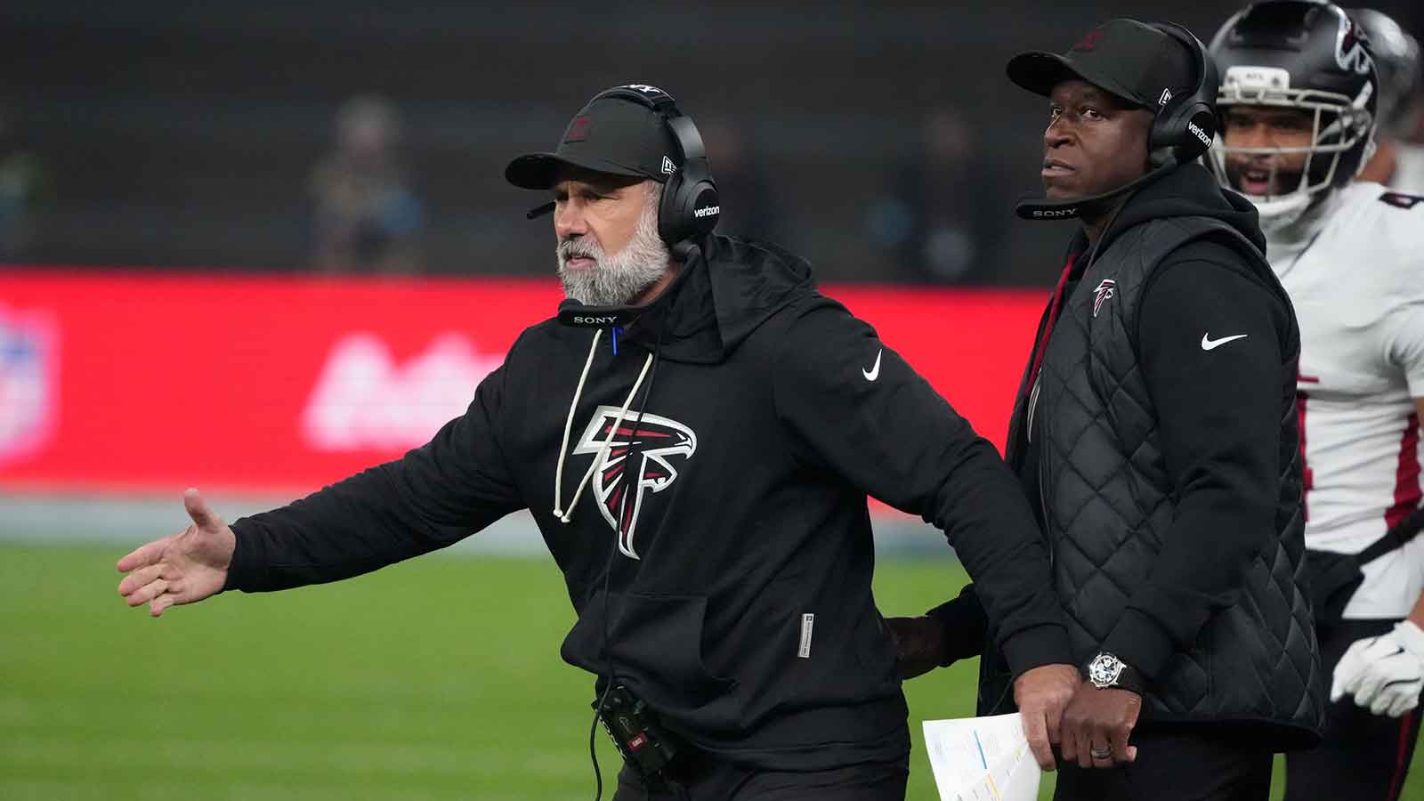 Atlanta Falcons defensive coordinator Jeff Ulbrich (left) and head coach Raheem Morris in the second half against the Atlanta Falcons during the NFL Berlin Game at Olympic Stadium.