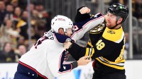 Boston Bruins left wing Jeffrey Viel (48) fights with Columbus Blue Jackets right wing Mathieu Olivier (24) during the first period at TD Garden.
