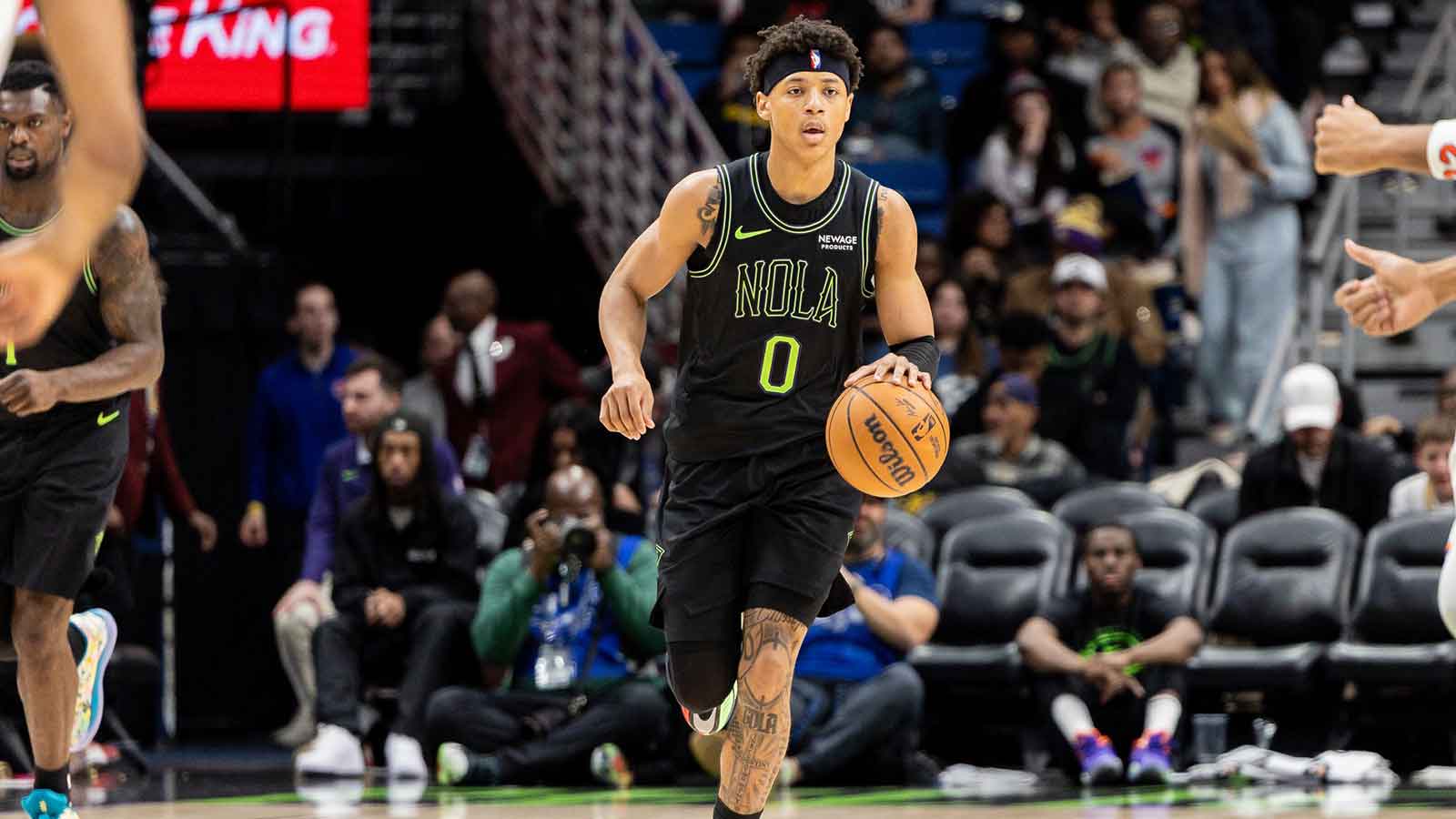 New Orleans Pelicans guard Jeremiah Fears (0) brings the ball up court against the New York Knicks during the second half at Smoothie King Center.