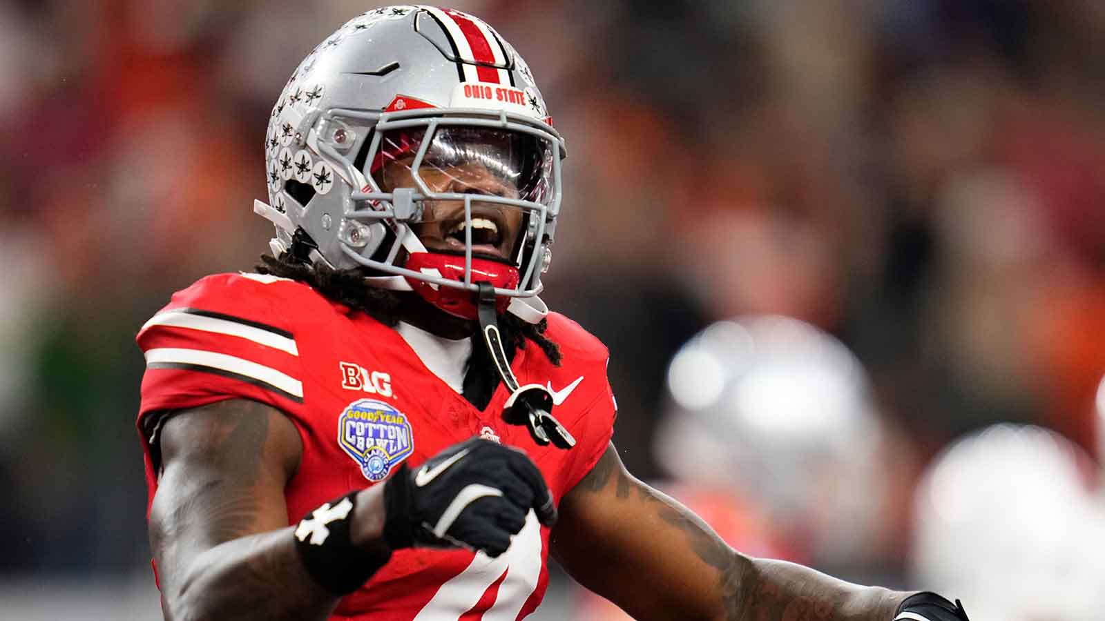 Ohio State Buckeyes wide receiver Jeremiah Smith (4) celebrates a touchdown during the Cotton Bowl at AT&T Stadium in Arlington, Texas for the College Football Playoff quarterfinal game against the Miami Hurricanes on Dec. 31, 2025. Ohio State lost 24-14.