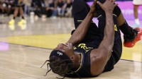 Golden State Warriors forward Jimmy Butler III (10) holds his right knee as he goes down with an injury during the third quarter against the Miami Heat at Chase Center. Mandatory Credit: Kelley L Cox-Imagn Images