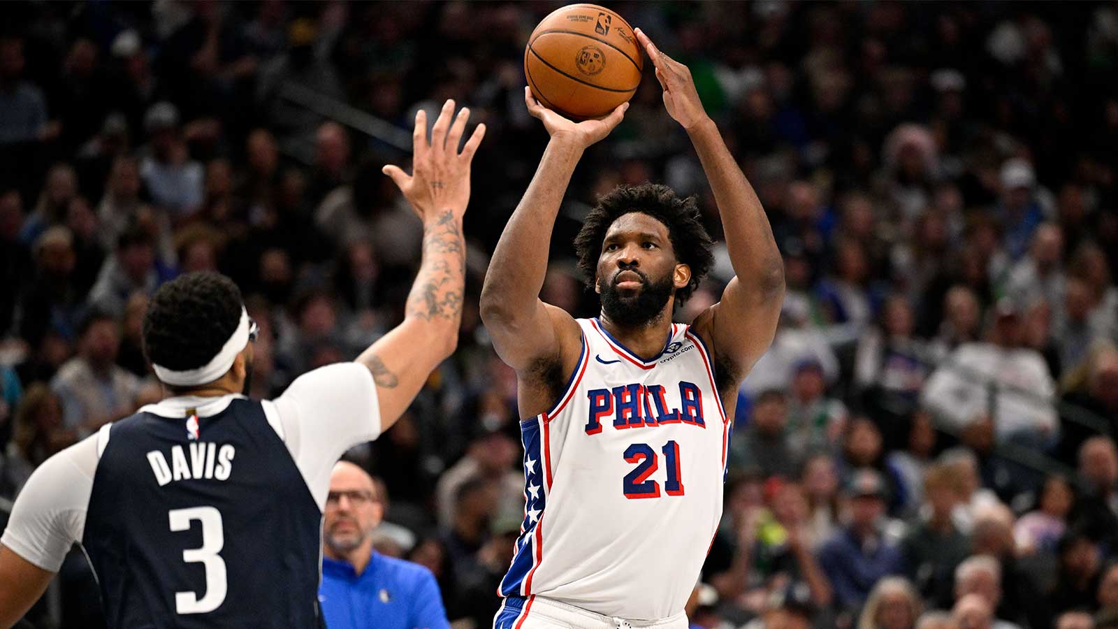Philadelphia 76ers center Joel Embiid (21) makes a shot over Dallas Mavericks forward Anthony Davis (3) during the second half at the American Airlines Center. 