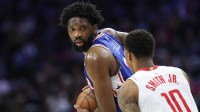 Philadelphia 76ers center Joel Embiid (21) controls the ball against Houston Rockets forward Jabari Smith Jr. (10) during the second quarter at Xfinity Mobile Arena.