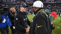 Baltimore Ravens head coach John Harbaugh shakes hands with Pittsburgh Steelers head coach Mike Tomlin after an AFC wild card game at M&T Bank Stadium.