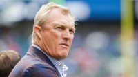 San Francisco 49ers general manager John Lynch watches pregame warmups against the Seattle Seahawks at Lumen Field.