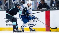 Toronto Maple Leafs forward John Tavares (91) skates against Seattle Kraken defenseman Adam Larsson (6) during the third period at Climate Pledge Arena.