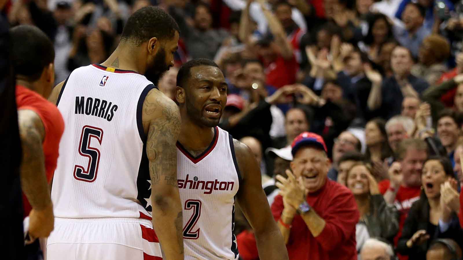 Washington Wizards guard John Wall (2) celebrates with Wizards forward Markieff Morris (5) after making the go-ahead three-point field goal against the Boston Celtics in the final seconds of the fourth quarter in game six of the second round of the 2017 NBA Playoffs at Verizon Center. The Wizards won 92-91, and tied the series at 3-3.