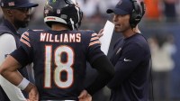 Chicago Bears head coach Ben Johnson talks with quarterback Caleb Williams (18) against the Dallas Cowboys during the second half at Soldier Field