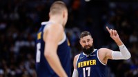 Denver Nuggets center Jonas Valanciunas (17) gestures as center Nikola Jokic (15) looks on in the second quarter against the New Orleans Pelicans at Ball Arena.
