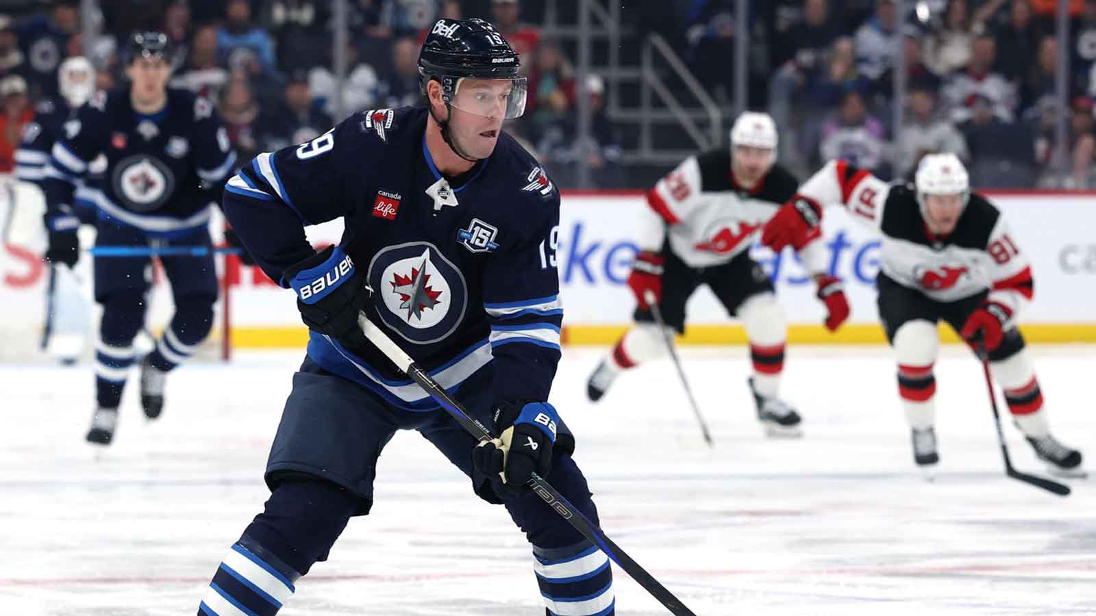 Winnipeg Jets center Jonathan Toews (19) skates through the neutral zone during a game against the New Jersey Devils in the second period at Canada Life Centre.