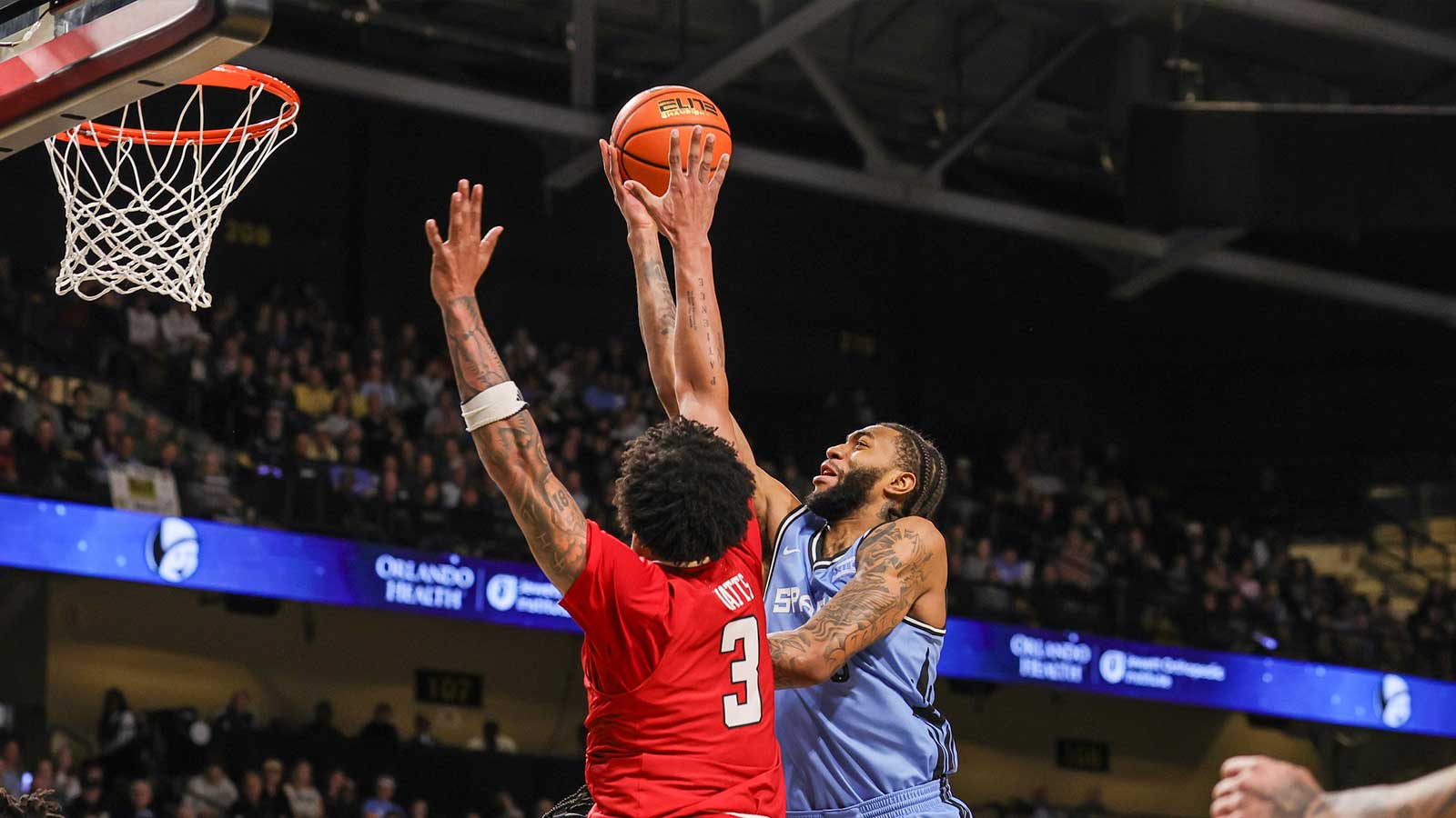 UCF Knights forward Jordan Burks (99) goes to the basket against Texas Tech Red Raiders forward Lejuan Watts (3) during the second half at Addition Financial Arena.