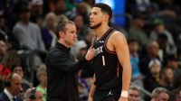 Phoenix Suns head coach Jordan Ott (left) with guard Devin Booker (1) against the Minnesota Timberwolves in the second half of an NBA Cup game at Mortgage Matchup Center.
